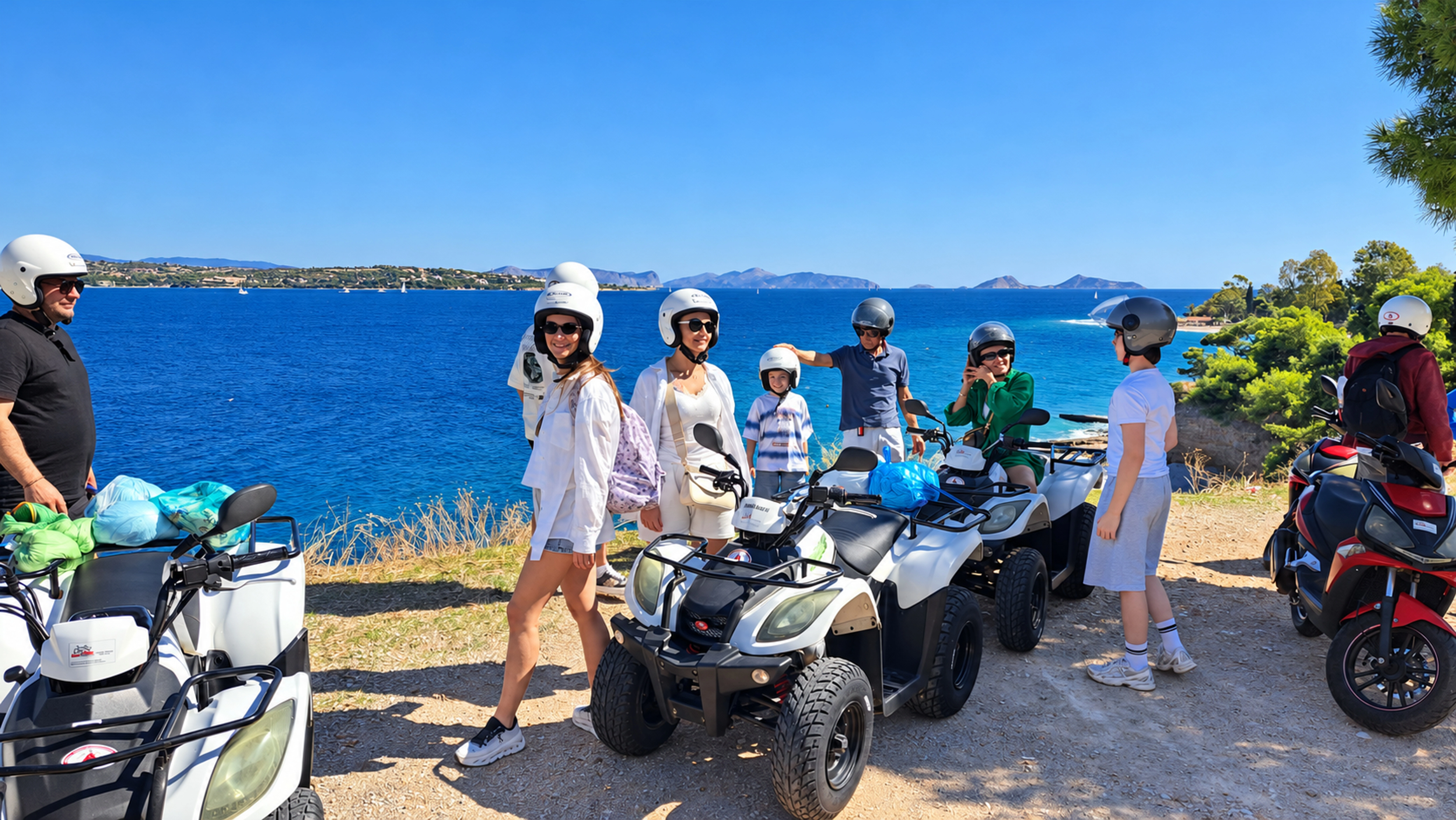 A group with quad bikes and scooters overlooking the blue Greek coast