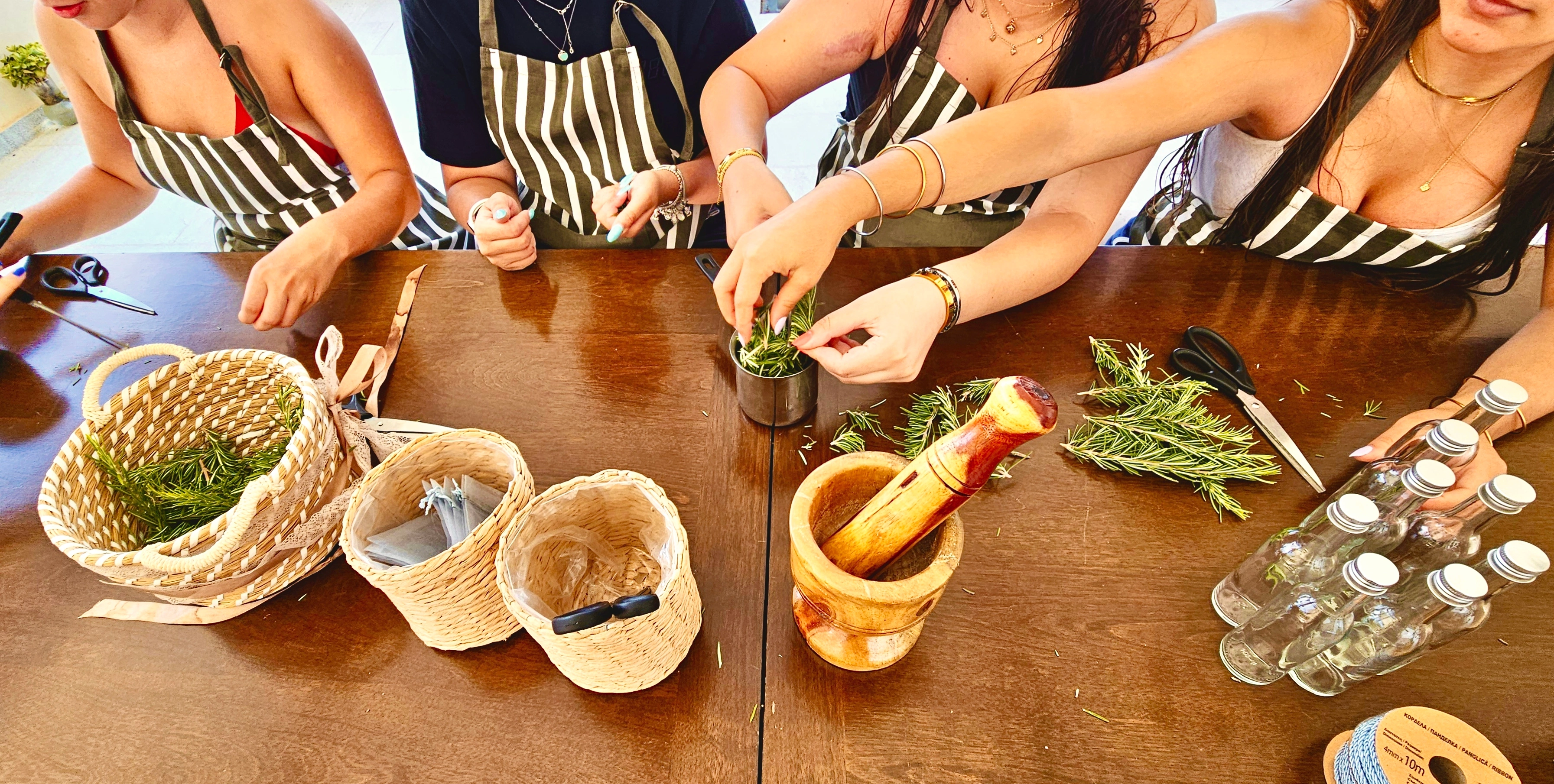 A craft workshop with hands working together at a table