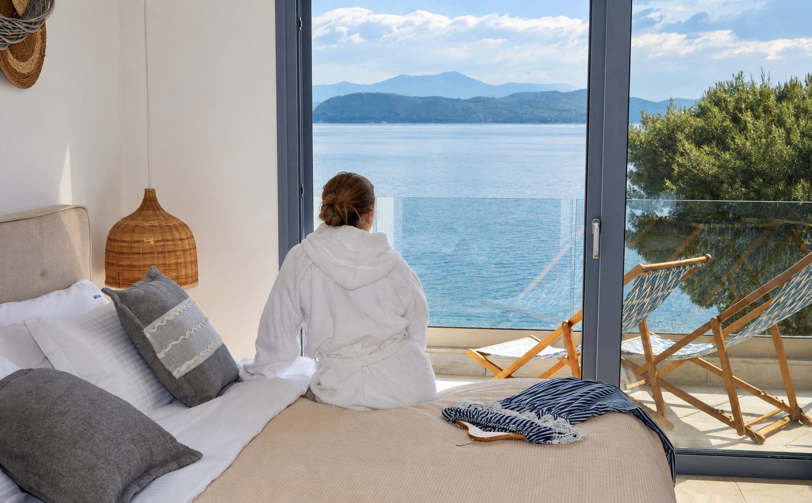 A quiet moment in an Anavalos room, with the balcony opening to the sea
